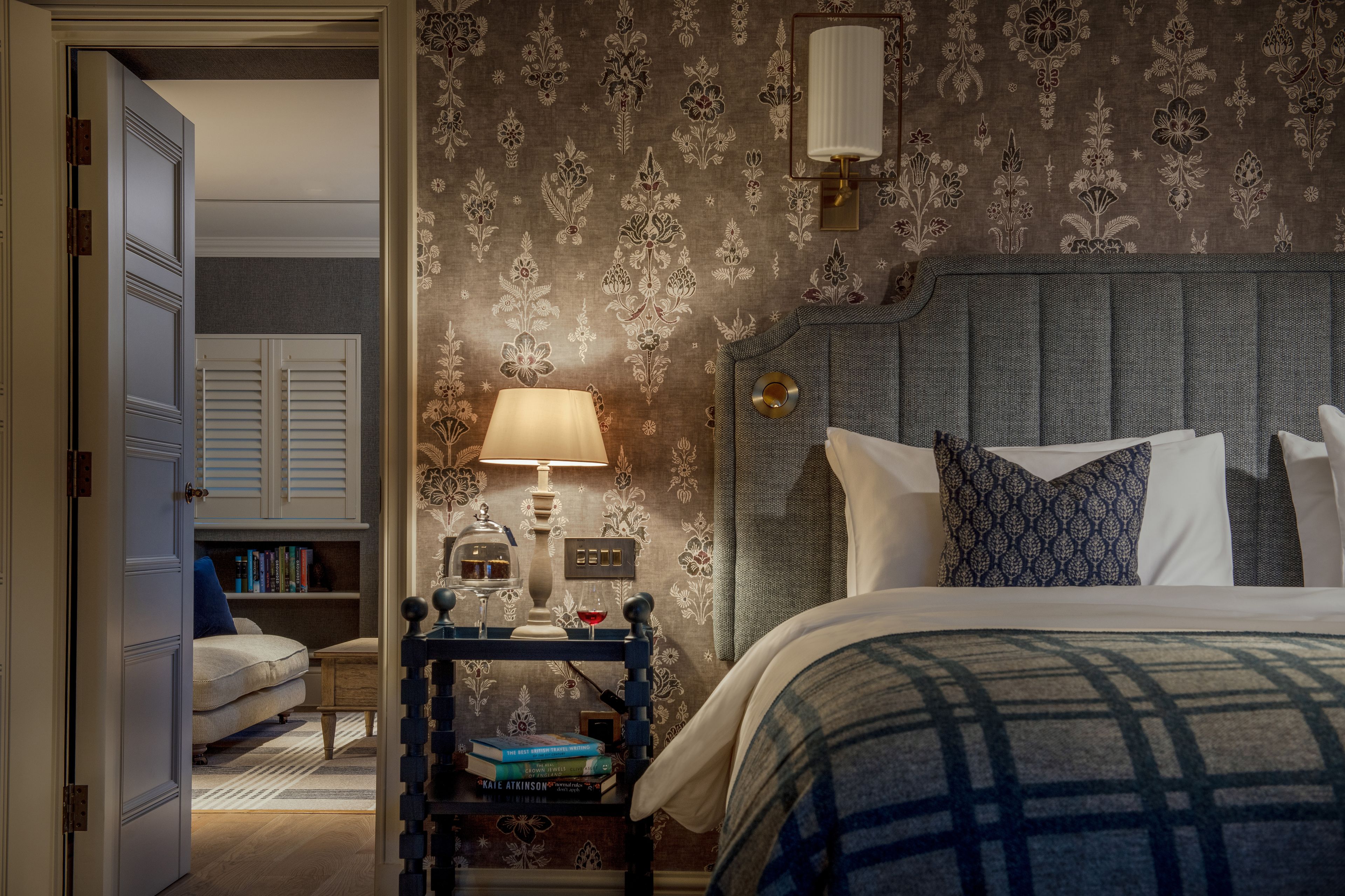 A bedroom with a side table