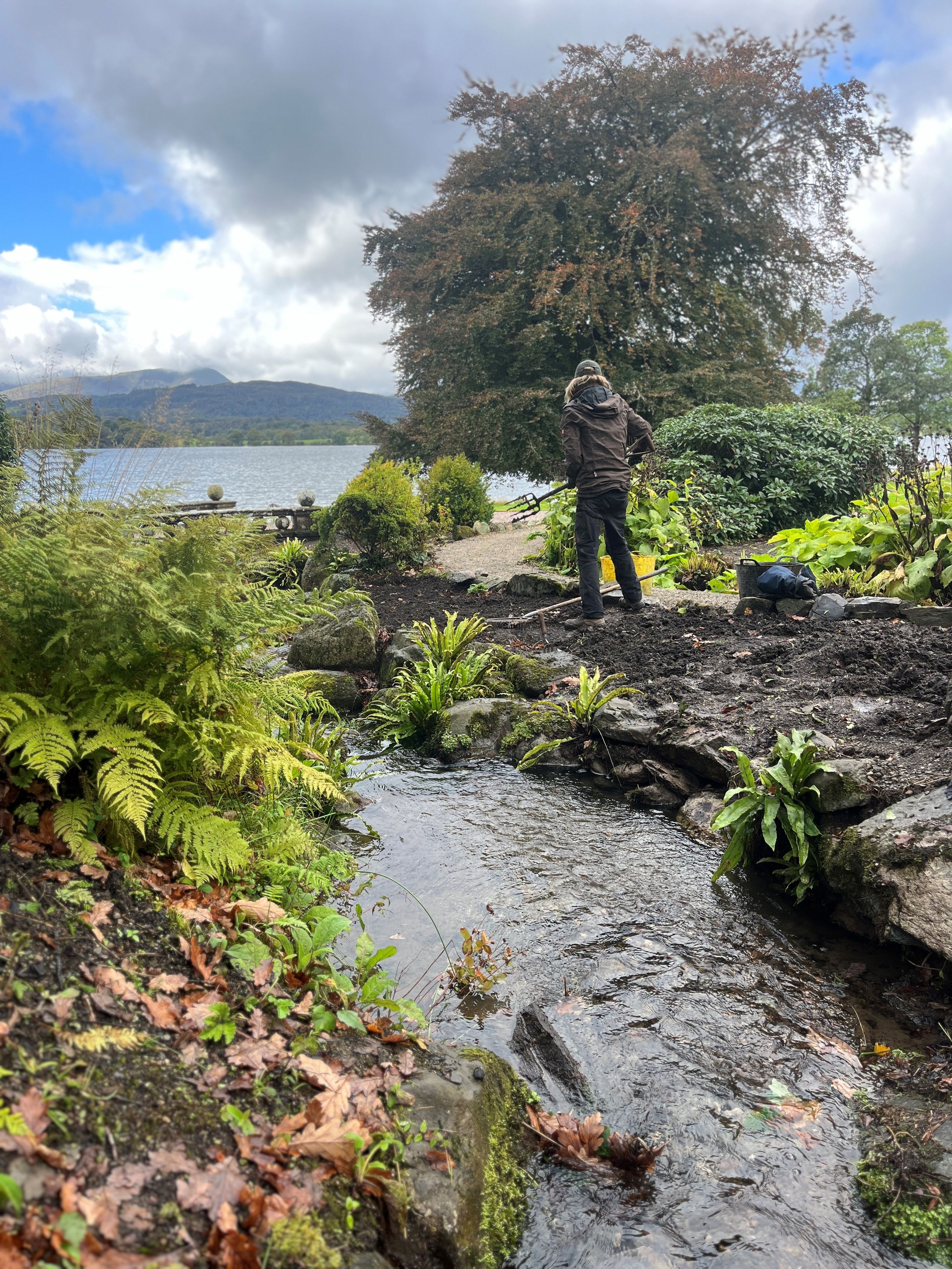 View of stream and Lake Windermere at Langdale Chase
