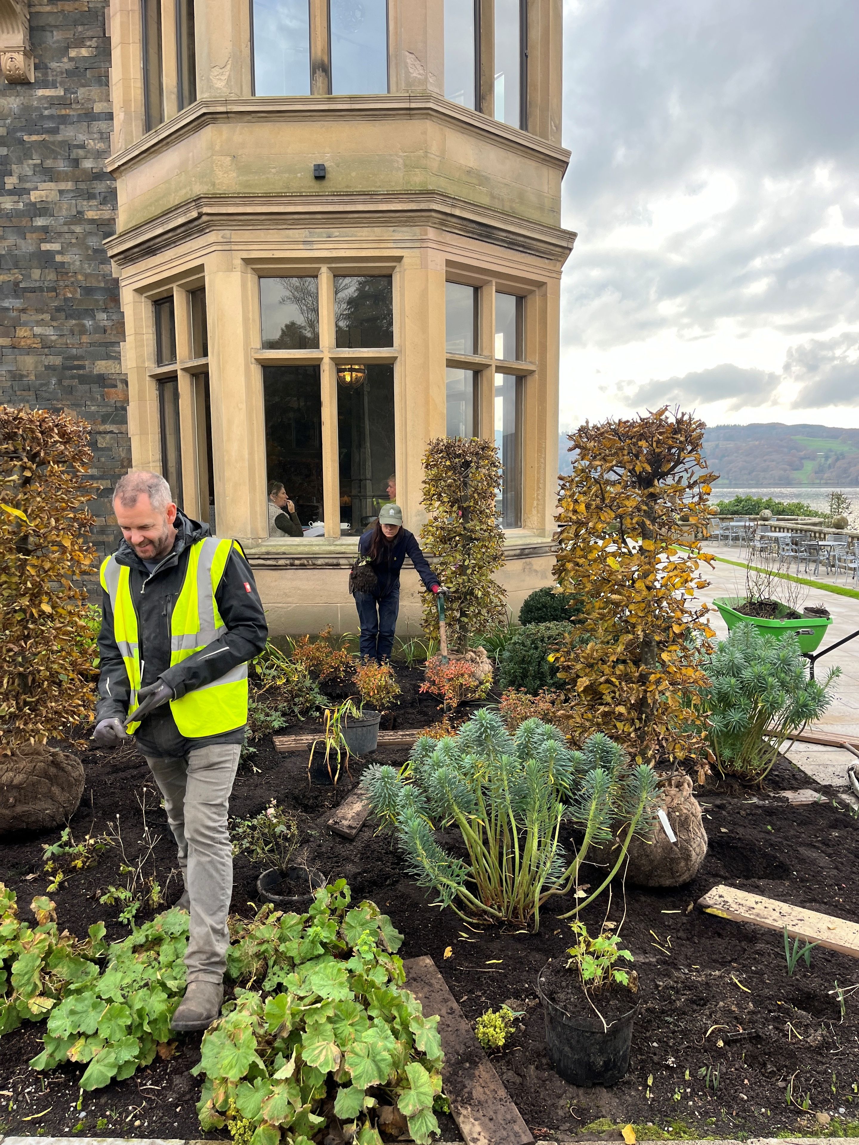 Langdale Chase team planting trees outside bar window