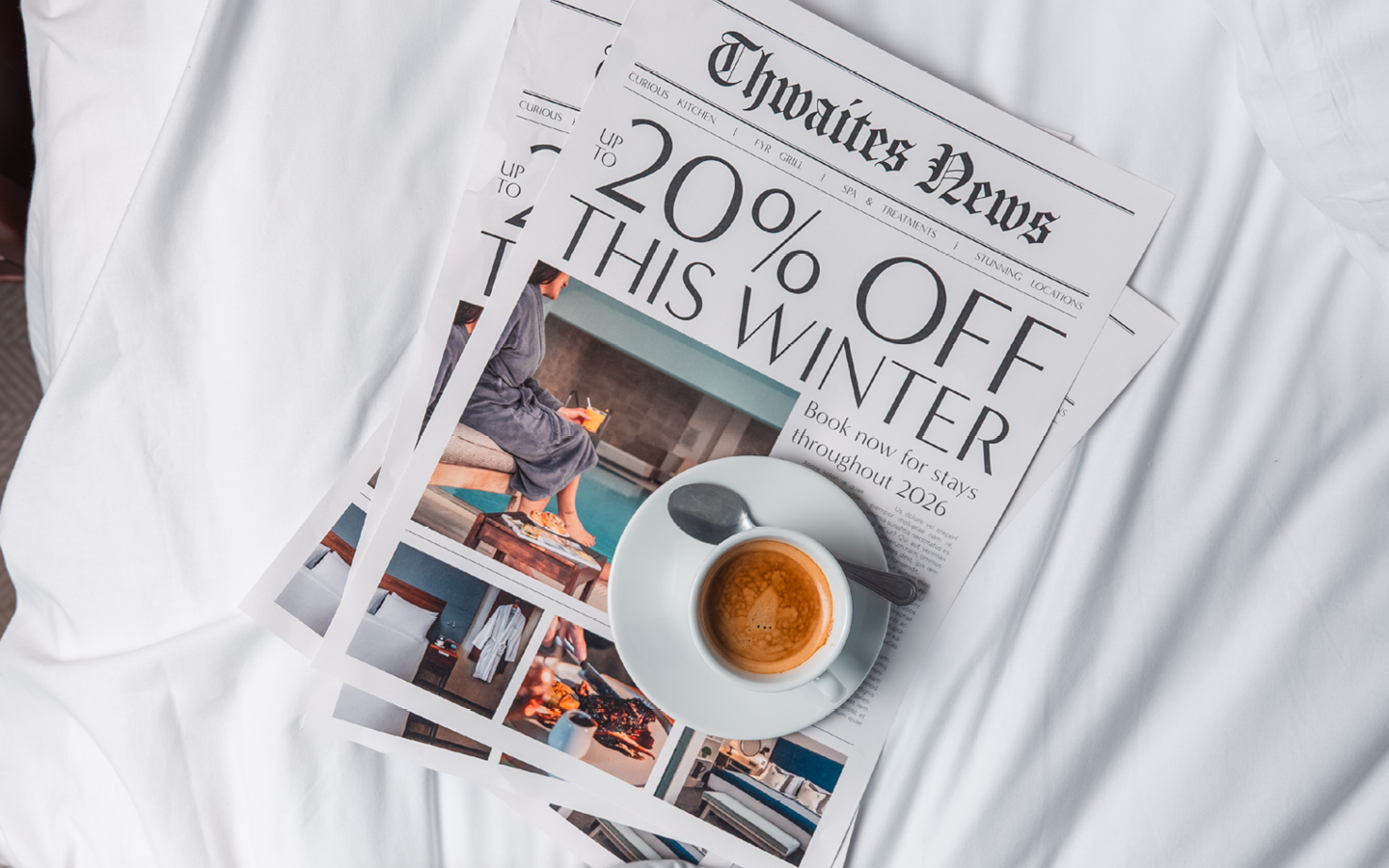 Newspaper on hotel bed that reads "Up to 20% off This Winter"