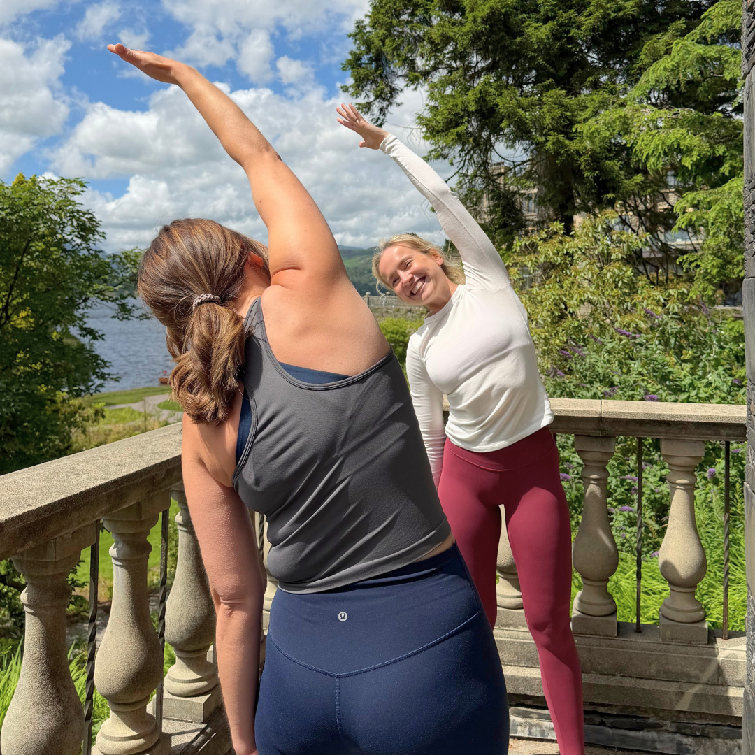 Ladies doing pilates on hotel balcony