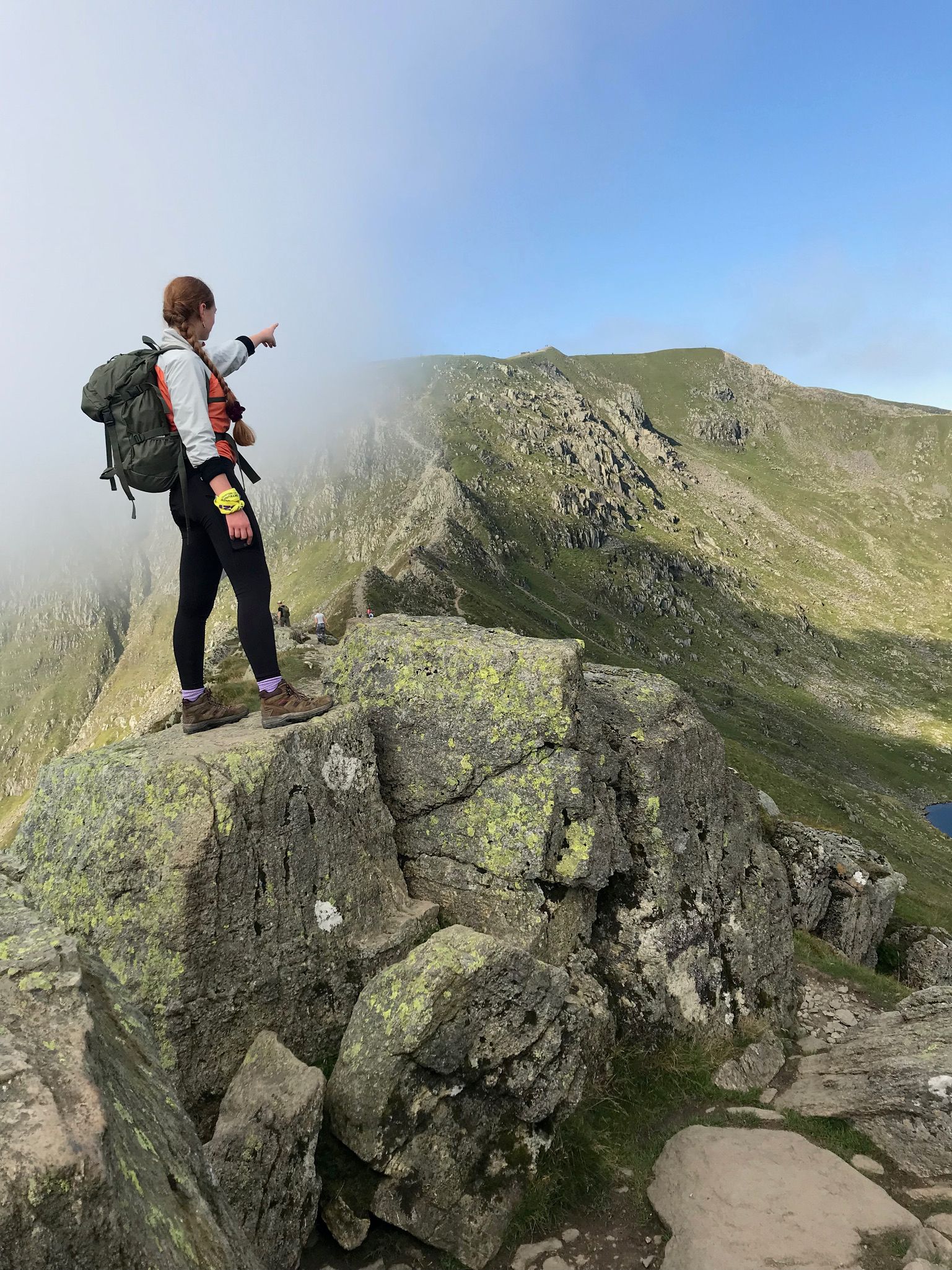 Woman at the top of mountain