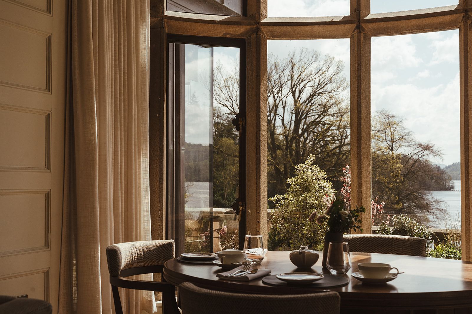 Dining table in front of bay window